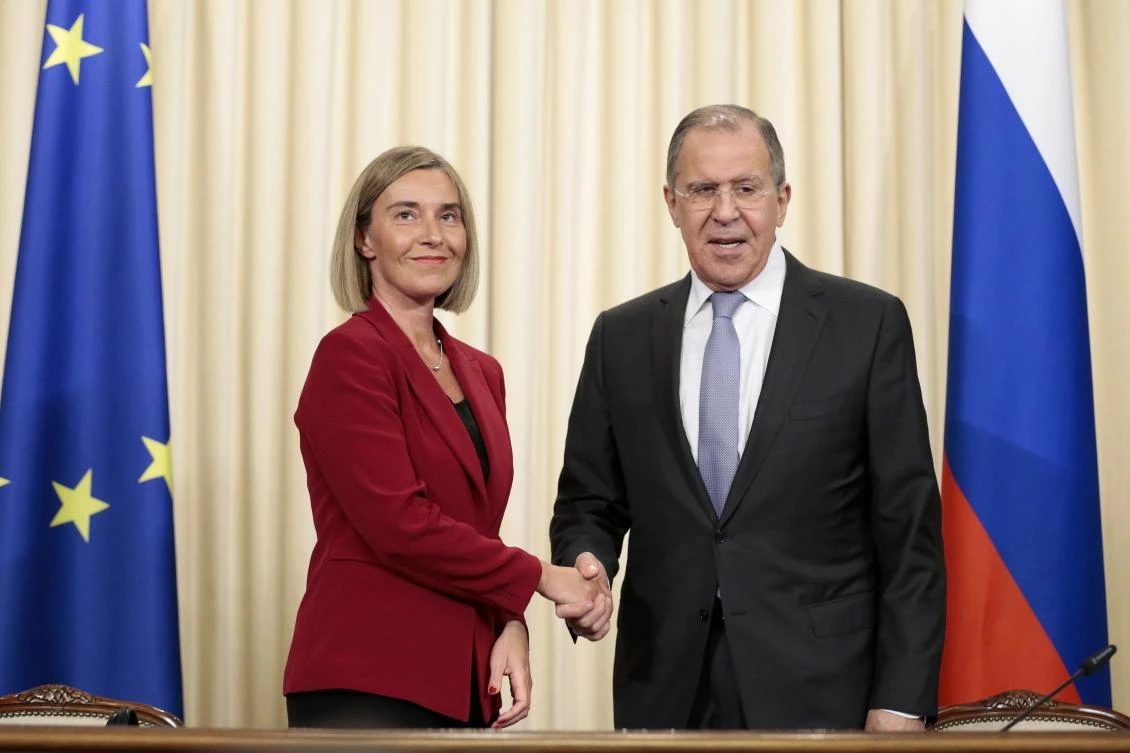 High Representative of the European Union for Foreign Affairs Federica Mogherini, left, and Russian Foreign Minister Sergey Lavrov shake hands. (AP)