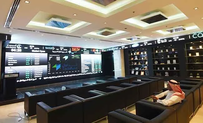A Saudi investor monitors the stock exchange at the Saudi Stock Exchange, or Tadawul, in this June 15, 2015 file photo, in the capital Riyadh. (AFP)