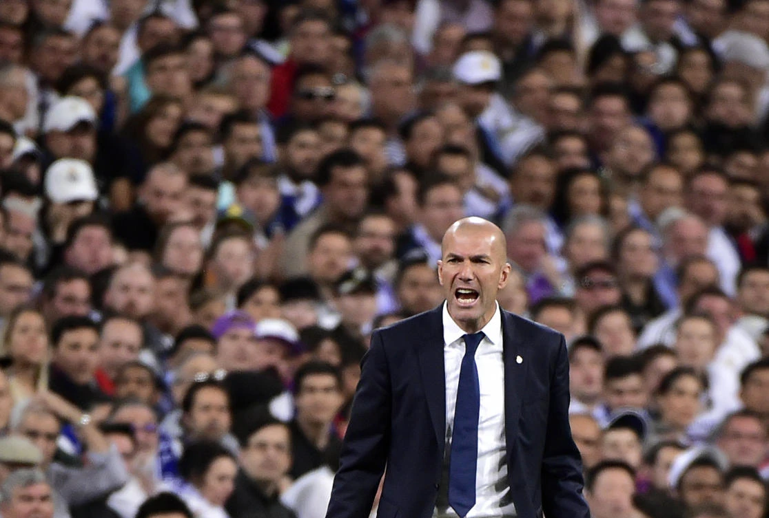 Real Madrid's French coach Zinedine Zidane shouts on the sideline during the Spanish league Clasico football match Real Madrid CF vs. FC Barcelona at the Santiago Bernabeu stadium in Madrid on Sunday. (AFP)