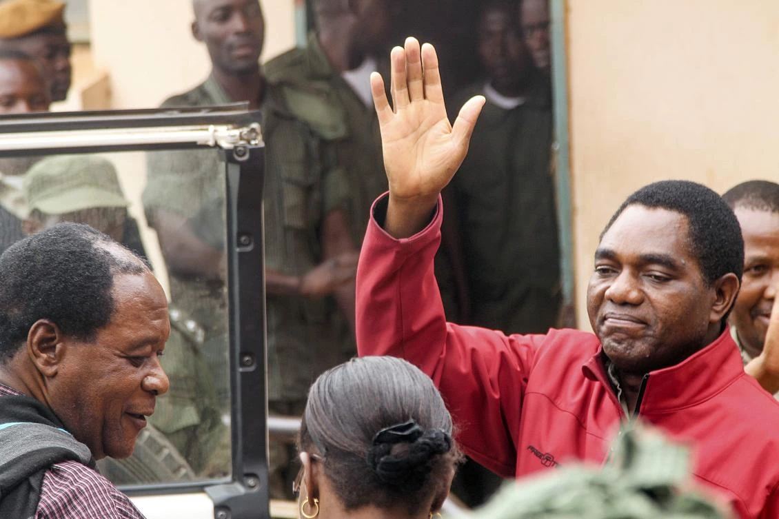 Zambian opposition leader Hakainde Hichilema waves to his supporters as he leaves a courtroom in Lusaka, in this file photo. (AFP)