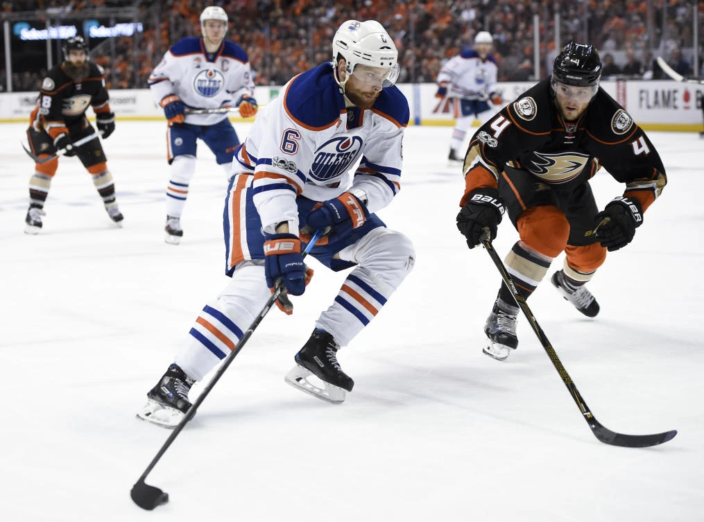 Edmonton Oilers defenseman Adam Larsson (6) moves the puck defended by Anaheim Ducks defenseman Cam Fowler during the third period in Game 1 of the second round of the 2017 Stanley Cup Playoffs at Honda Center on Wednesday. Edmonton won 5-3. (USA TODAY Sports)