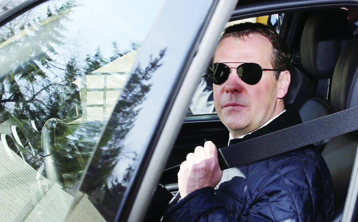 Russian Prime Minister Dmitry Medvedev looks out from a car as he visits the Siberian city of Omsk on Tuesday. (AFP)