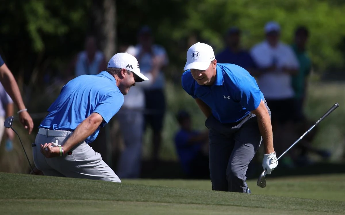 Jordan Spieth and Ryan Palmer react to their shot on the 14th hole during the first round of the Zurich Classic at TPC Louisiana in Avondale on Thursday. (AFP)