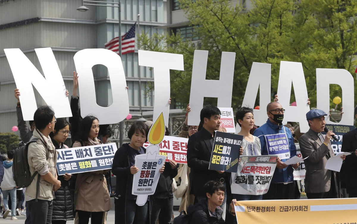 South Koreans hold letters reading "NO THAAD" during a rally to oppose a plan to deploy an advanced U.S. missile defense system called Terminal High-Altitude Area Defense, or THAAD, near the U.S. Embassy in Seoul, South Korea. (AP)