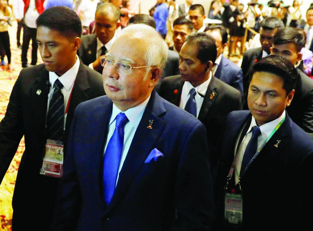 Malaysian Prime Minister Najib Razak arrives to address a forum ahead of the Association of Southeast Asian Nations (ASEAN) summit in Manila. (Reuters)