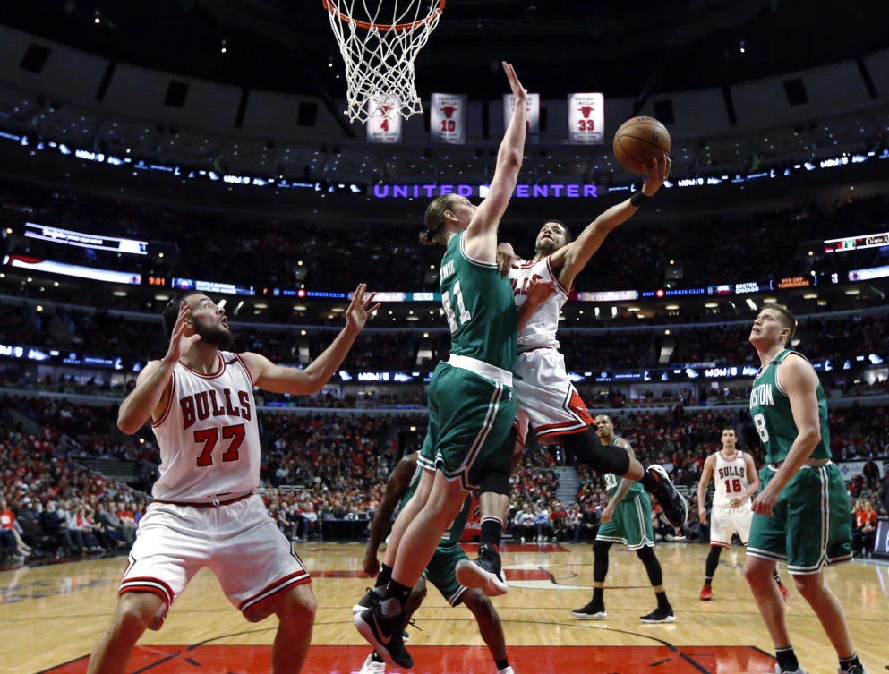 Chicago Bulls guard Michael Carter-Williams (7) drives to the basket against Boston Celtics forward Kelly Olynyk (41) during the second half in Game 6 of an NBA basketball first-round playoff series in Chicago on Friday. (AP)