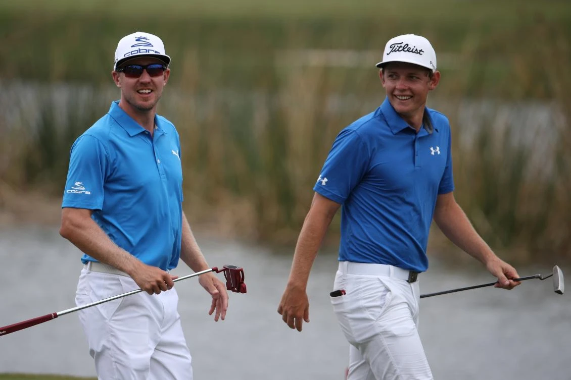 Cameron Smith and Jonas Blixt walk up the 9th fairway during the second round of the Zurich Classic at TPC Louisiana in Avondale, Louisiana, on Friday. (AFP)