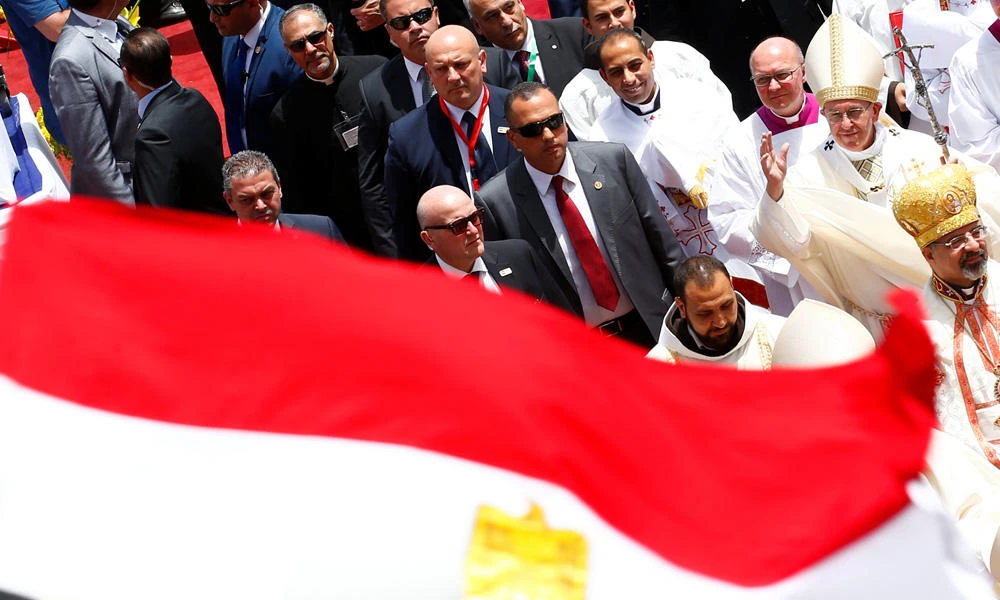 An Egyptian flag flies near Pope Francis after his mass in Cairo, Egypt, on Saturday. (REUTERS/Amr Abdallah Dalsh)
