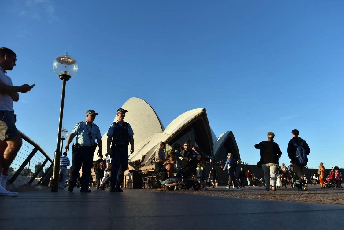 Police officers patrol on the eve of ANZAC day at the Opera House in Sydney on April 24, 2017. (AFP)