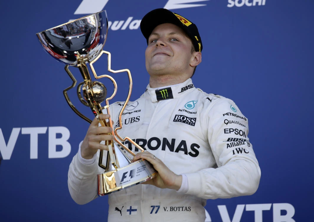 Mercedes driver Valtteri Bottas of Finland celebrates his victory at the Formula One Russian Grand Prix at the 'Sochi Autodrom' circuit, in Sochi, Russia, Sunday, April. 30, 2017. (AP Photo/Pavel Golovkin)