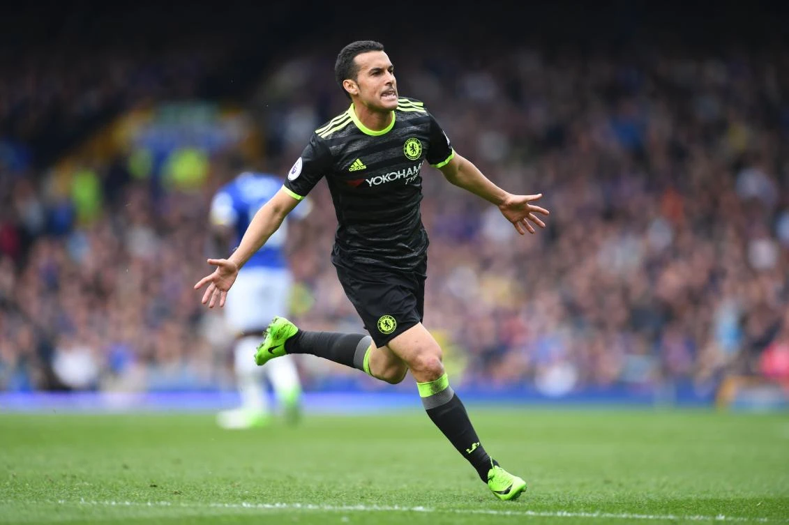 Chelsea's Spanish midfielder Pedro celebrates scoring the opening goal during the English Premier League football match between Everton and Chelsea at Goodison Park in Liverpool, north west England on Sunday. (AFP)
