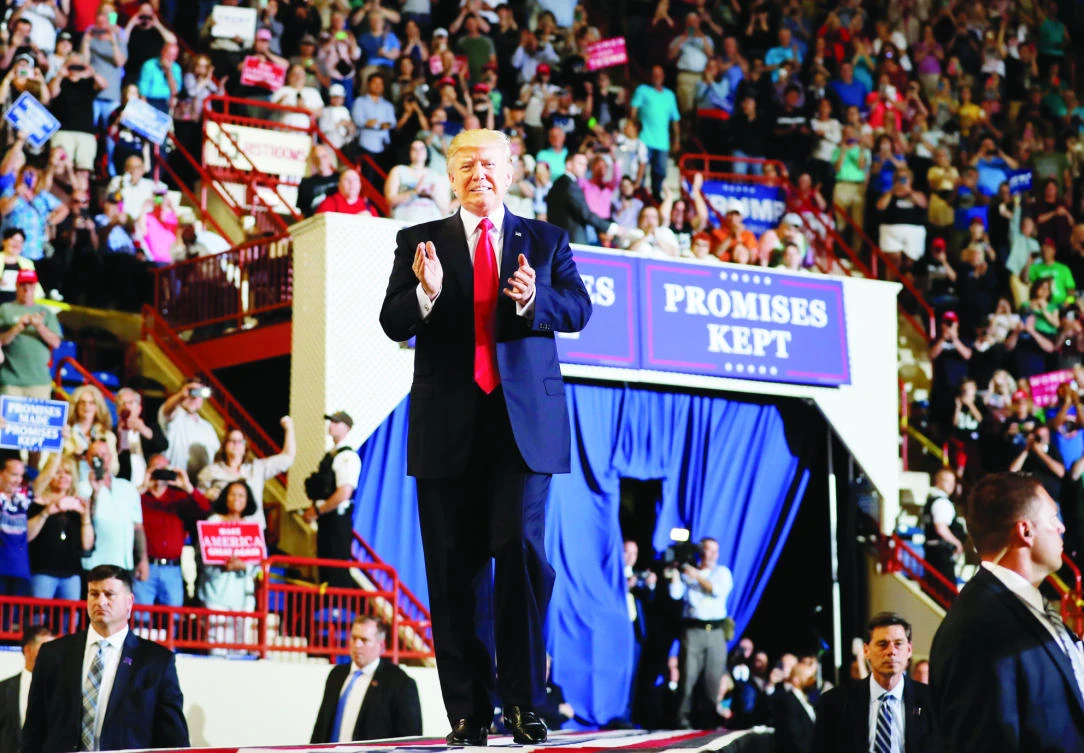 President Donald Trump arrives to speak at the Pennsylvania Farm Show Complex and Expo Center in Harrisburg, Pa., on Saturday. (AP)