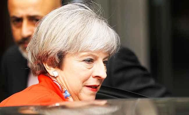Britain's Prime Minister Theresa May leaves the BBC, in London, on Sunday. (REUTERS)