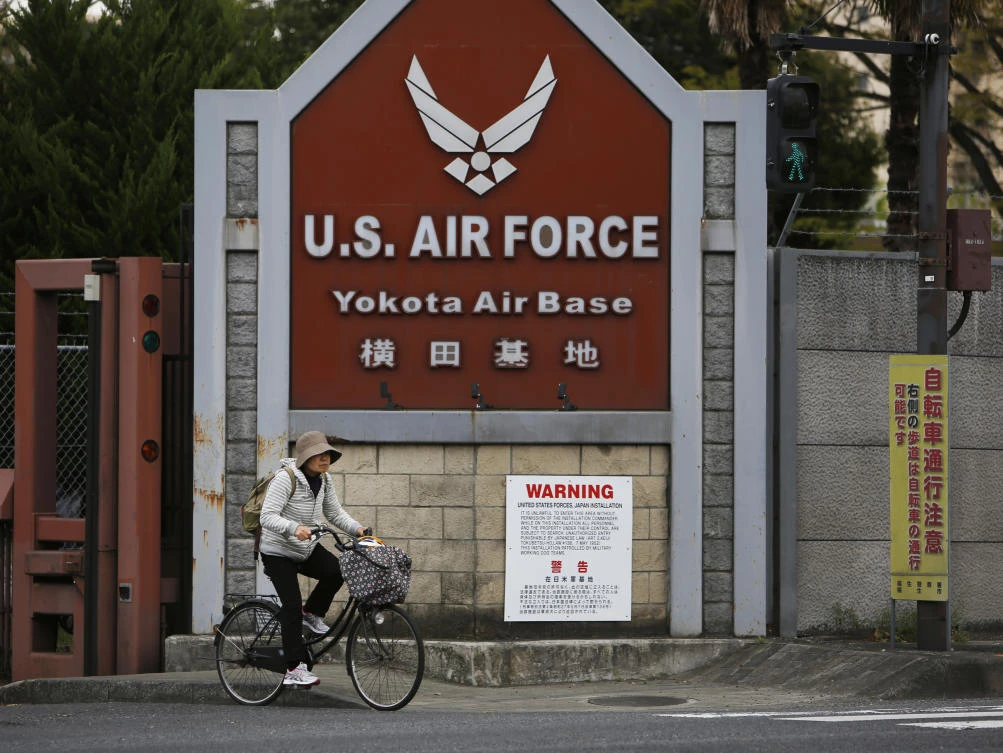 cycles out from the US Air Force’s Yokota Air Base in Fussa in Tokyo’s western suburbs. Residents living near US military bases in Japan ,(AP Photo)