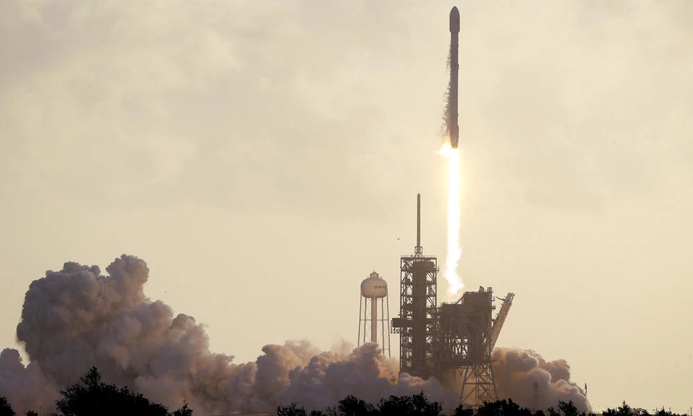 A Falcon 9 SpaceX rocket carrying a classified satellite for the National Reconnaissance Office lifts off from pad 39A at the Kennedy Space Center in Cape Canaveral, Florida, on Monday. (AP Photo/John Raoux)