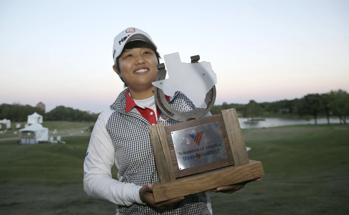 Haru Nomura, of Japan, with the trophy after winning on the sixth playoff hole against Christie Kerr to win the LPGA Texas Shootout golf tournament in Irving, Texas, Sunday. (AP)