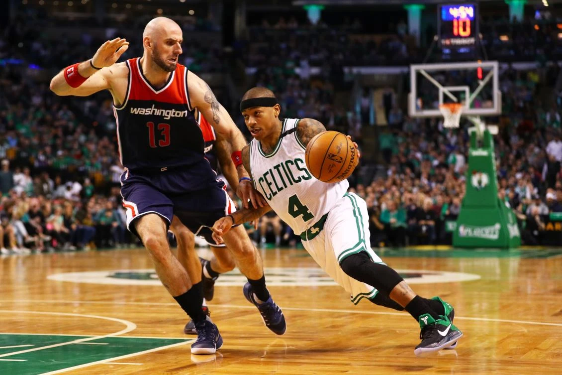 Isaiah Thomas, of the Boston Celtics, drives against Marcin Gortat, of the Washington Wizards, during the fourth quarter of Game 1 of the Eastern Conference Semifinals at TD Garden on Sunday in Boston, Massachusetts. The Cetics beat the Wizards 123-111. (AFP)