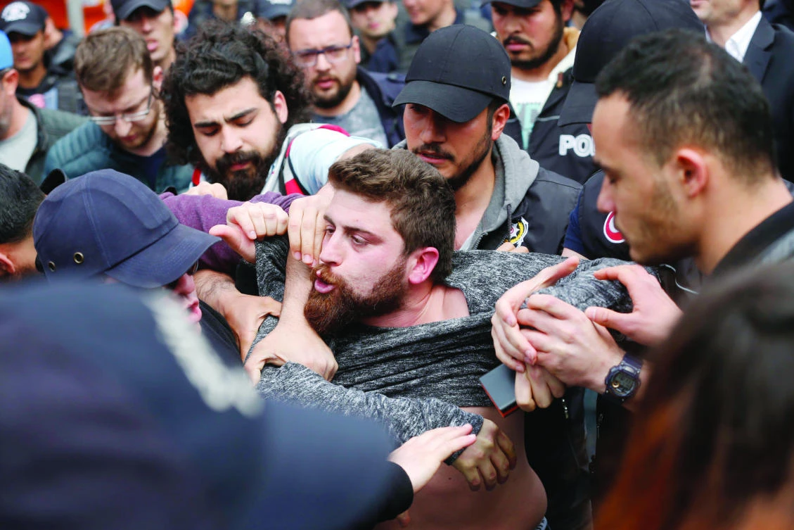 Police arrest a demonstrator during a May Day protest in Istanbul. (AP)