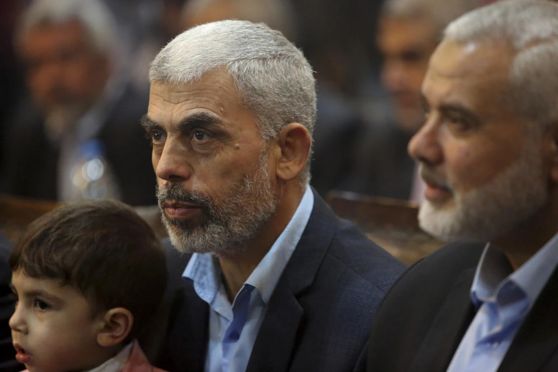 Yehiya Sinwar, left, a top Hamas official in Gaza sits near Ismail Haniyeh. (AP Photo/Adel Hana)