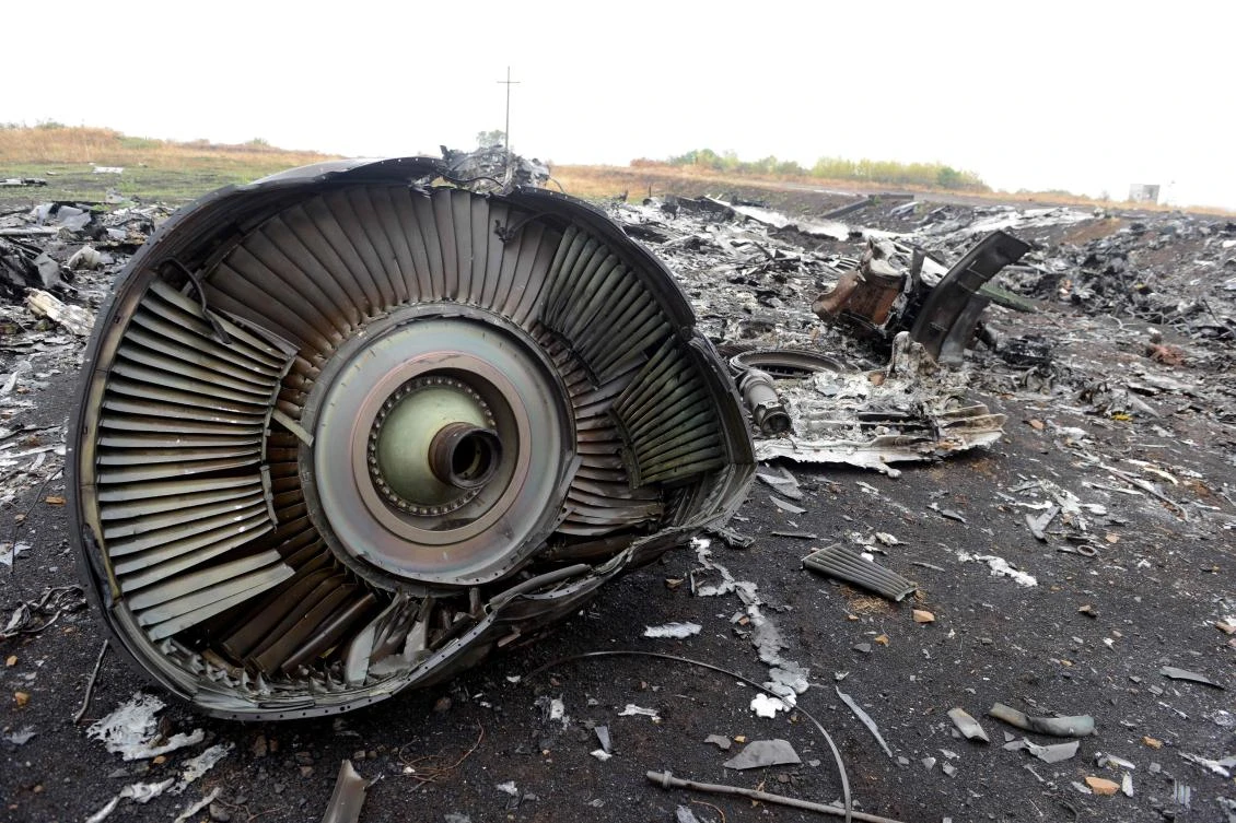 The engine of the Malaysia Airlines Flight MH17's Boeing 777 at the crash site in the village of Hrabove (Grabovo), some 80km east of Donetsk. (AFP)