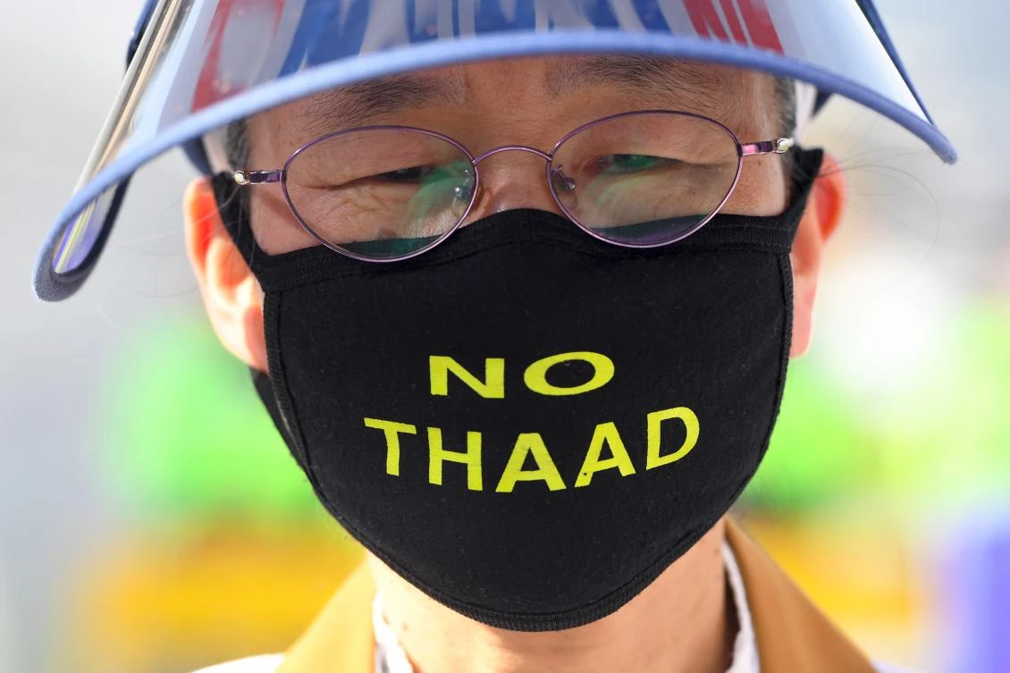 A South Korean protester wears a face mask reading "No THAAD" during a rally against the deployment of the US Terminal High Altitude Area Defense (THAAD) system near the US embassy in Seoul. (AFP)