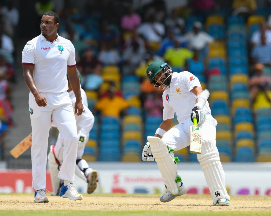 Azhar Ali, right, of Pakistan, gets runs off Shannon Gabriel, left, of West Indies, during the second day of the 2nd Test match between West Indies and Pakistan at Kensington Oval, Bridgetown, Barbados, on Monday. (AFP)