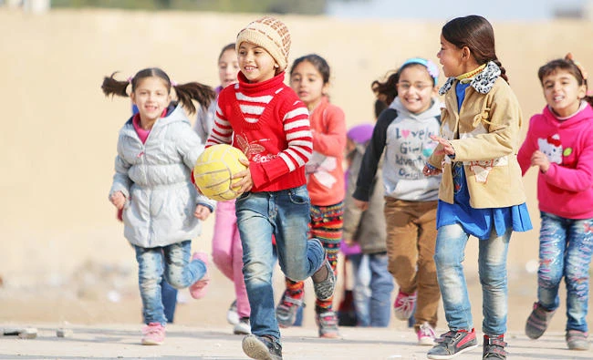 School children play with a ball in a playground in Ras al-Ain city, Syria, in this February 1, 2016 file photo. (REUTERS)