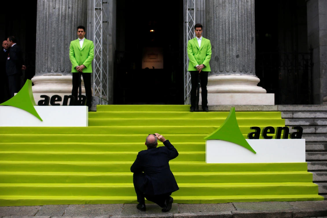 A man takes a photo before the stock market debut of the Spanish airports group Aena outside the bourse in Madrid on February 11, 2015. The euro zone economy started the year with robust growth that outstripped that of the US and set the stage for a strong 2017, preliminary estimates showed on Wednesday. (REUTERS/Susana Vera/File Photo)