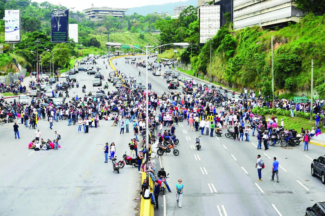 Demonstrators block the “Prados del Este” highway, one of the major roads in Caracas, during a protest against Venezuelan President Nicolas Maduro on Tuesday. (AFP)