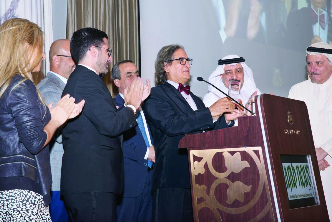 Othman Al-Omeir accepts his honor surrounded by former colleagues Mohammad Al Tunisi, Ghassan Charbel, Khaled Almaeena, NadimKotaish and Samar Abdul Malak.