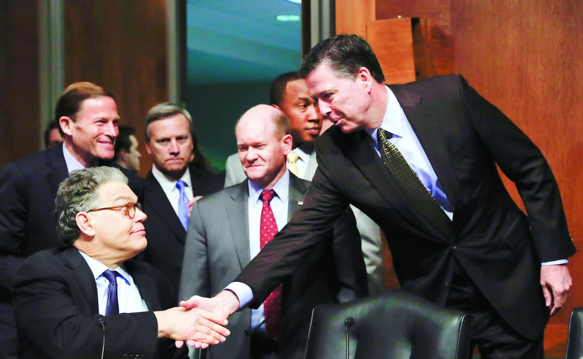 FBI Director James Comey shakes hands with Senate Judiciary Committee member Sen. Al Franken, in Washington on Wednesday. (AP)