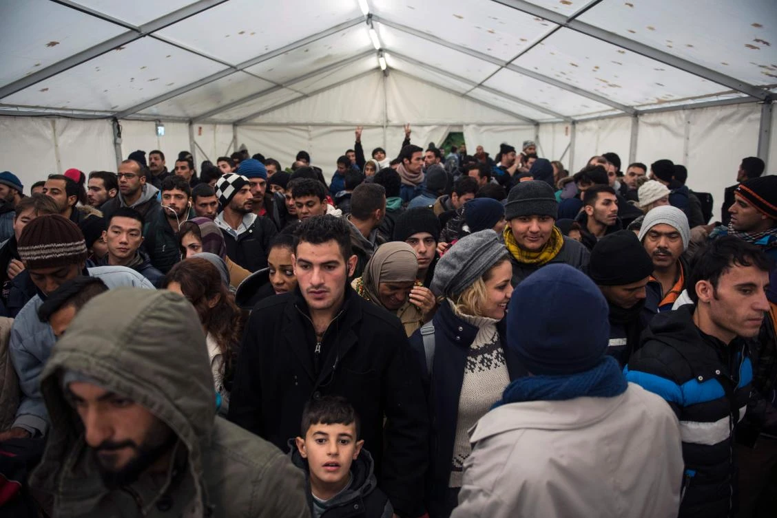 This file photo taken on October 15, 2015 shows newly arrived immigrants waiting at the Office of Health and Social Affairs LAGESO in Berlin on October 15, 2015. (AFP)