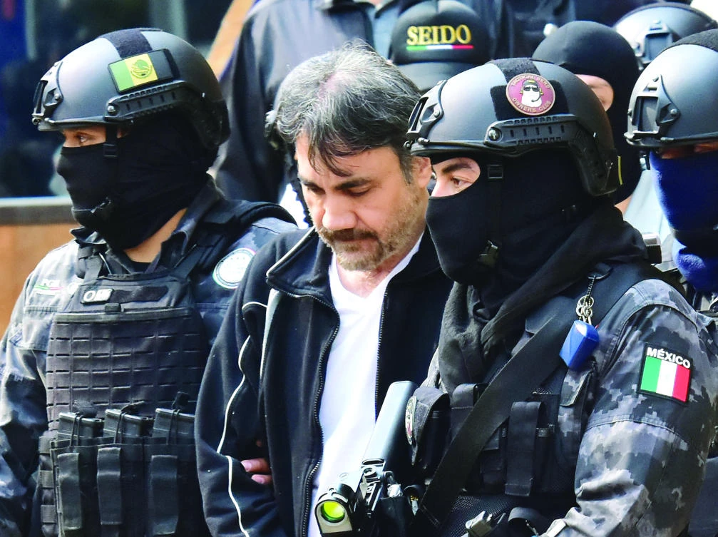 Soldiers escort Damaso Lopez, a senior lieutenant of Joaquin “Chapo” Guzman, after arresting him in Mexico City recently. (AFP)