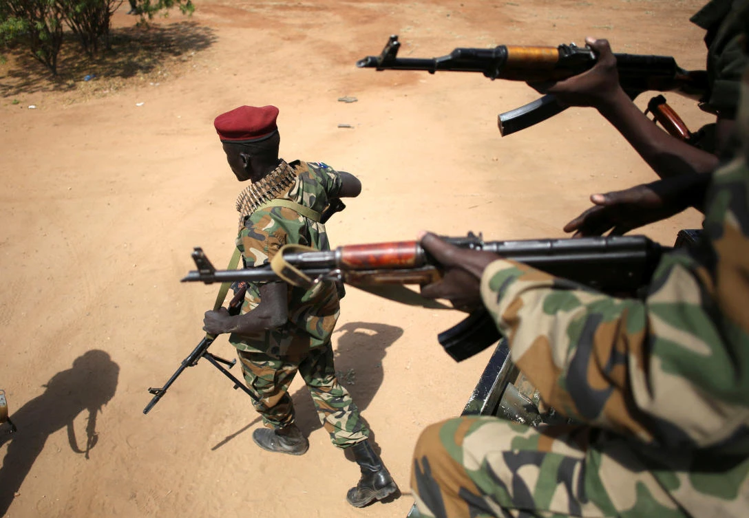 An SPLA soldier walks away from a vehicle in Juba, South Sudan. (Reuters)