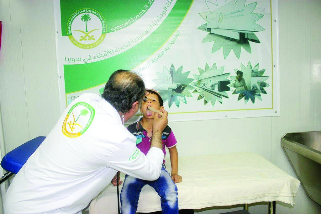 A Syrian child receives medical treatment at a specialized clinic at Zaatari camp in Jordan. (SPA)