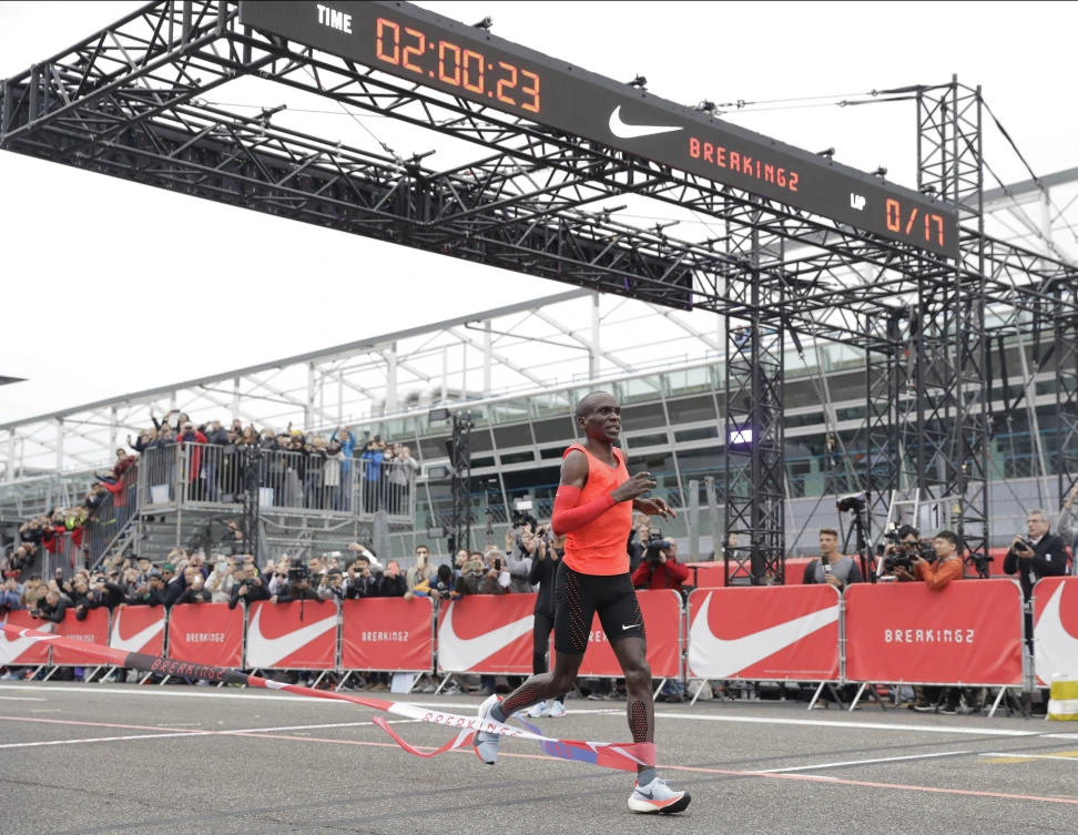 Olympic marathon champion Eliud Kipchoge crosses the finish line of a marathon race at the Monza Formula One racetrack in Italy Saturday. (AP)