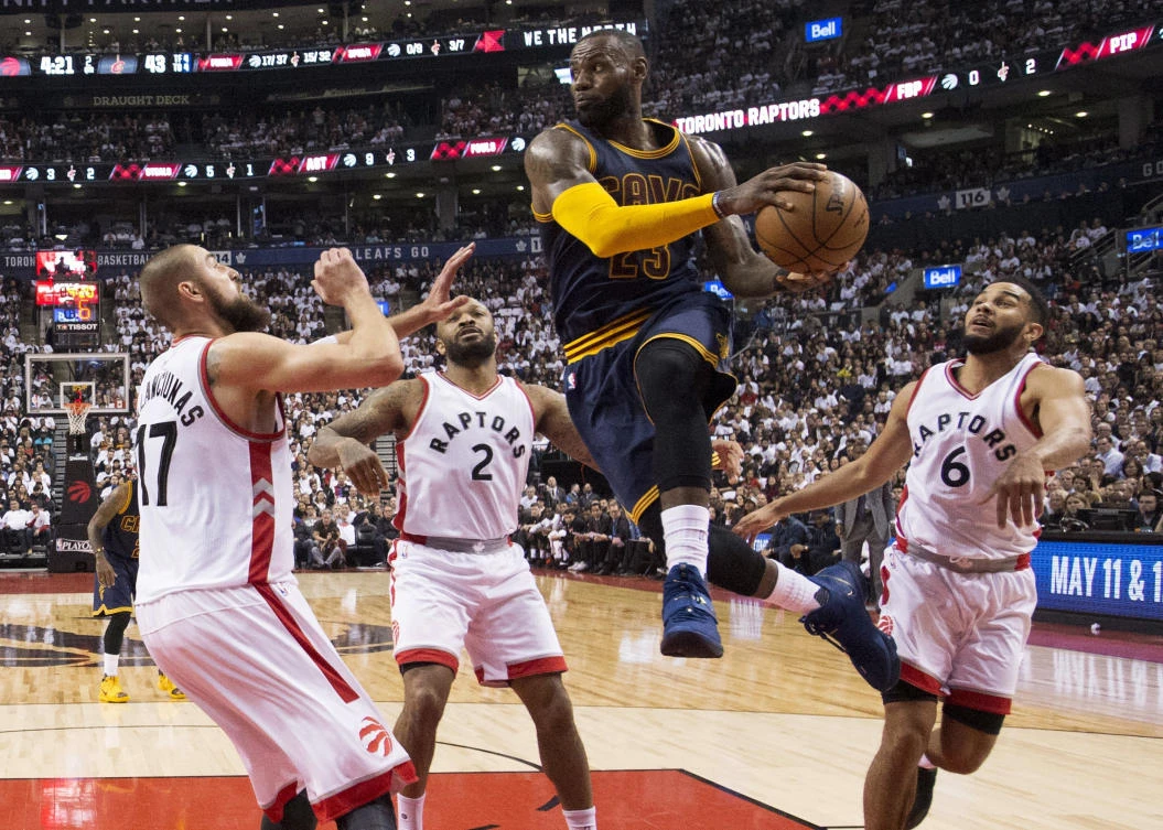 Cleveland Cavaliers forward LeBron James drives to the basket past Toronto Raptors center Jonas Valanciunas (17), Raptors forward PJ Tucker (2) and Raptors guard Cory Joseph (6) during the first half of Game 3 of an NBA basketball second-round playoff series in Toronto on Friday. (AP)