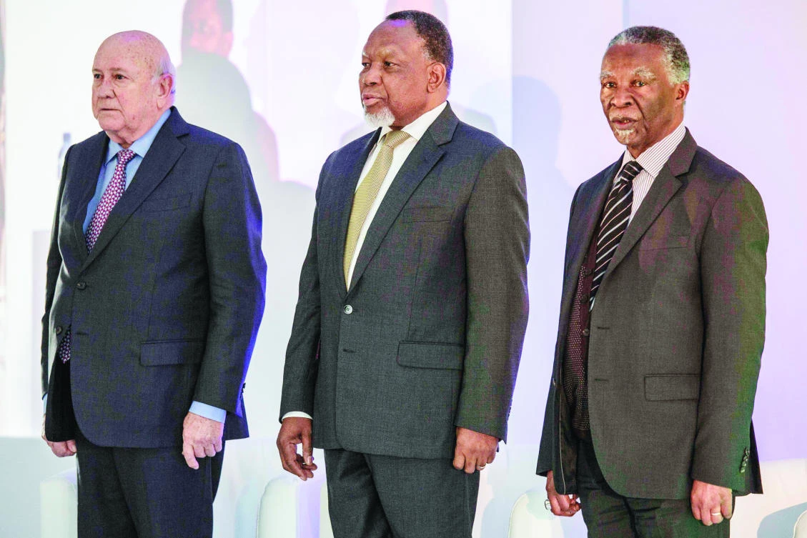 Former S. African presidents Frederik de Klerk, left, Kgalema Motlanthe, center, and Thabo Mbeki pose during an event in Johannesburg on Friday. (AFP)