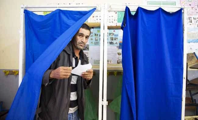 An Algerian man casts his vote at a polling station in the town of Blida, 45 kilometres southwest of Algiers, in this May 4, 2017 photo, during parliamentary elections. (AFP)