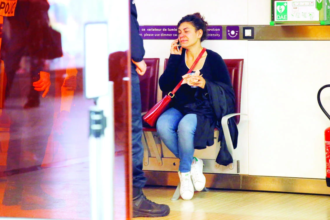 A relative of the victims of the EgyptAir flight 804 that crashed reacts as she makes a call at Charles de Gaulle Airport outside Paris on May 19, 2016. (AP)