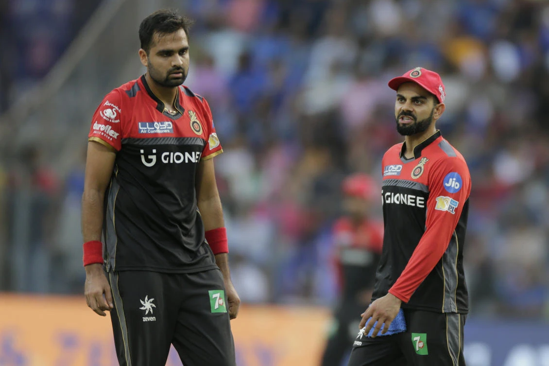 Royal Challengers Bangalore's player Virat Kohli speaks with teammate Aniket Choudhary during their Indian Premier League cricket match in Mumbai recently. (AP)