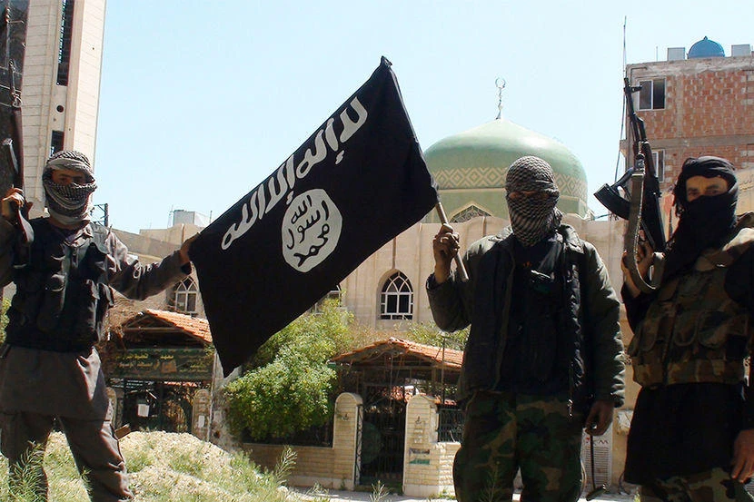 Daesh militants waving their flag. (AP)