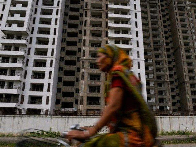 From the mid-2000s a property boom in India led to apartment buildings mushrooming on the outskirts of major cities as millions of middle class Indians bought flats, but the industry was riddled with problems and the buyers almost always the victims. (AFP)