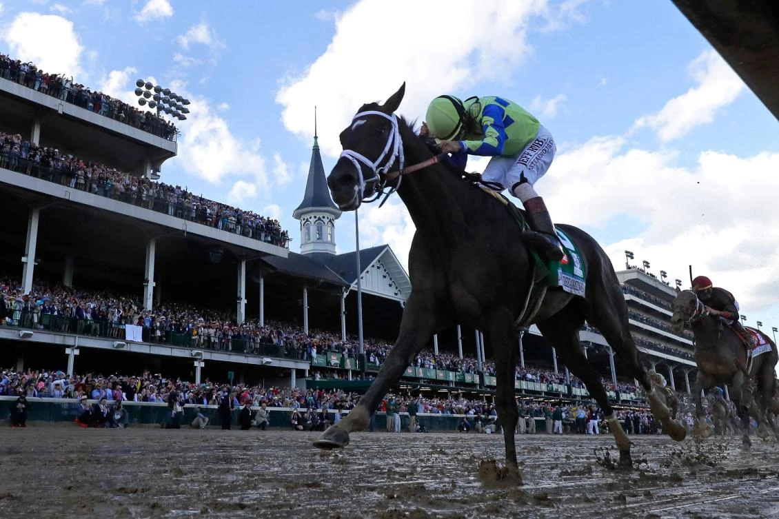 Jockey John Velazquez celebrates as he guides Always Dreaming across the finish line to win the 143rd running of the Kentucky Derby at Churchill Downs on Saturday in Louisville, Kentucky. (AFP)