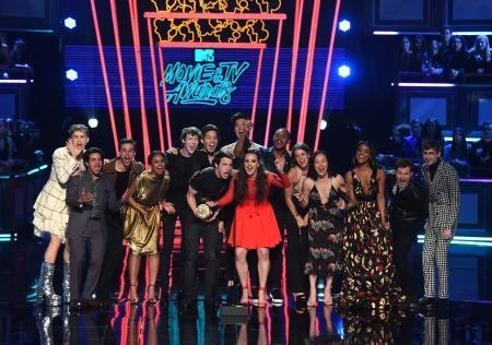 Actors Dylan Minnette and Katherine Langford (C) with the cast of ‘13 Reasons Why’ speak onstage during the 2017 MTV Movie And TV Awards at The Shrine Auditorium on May 7, 2017 in Los Angeles. (AFP)