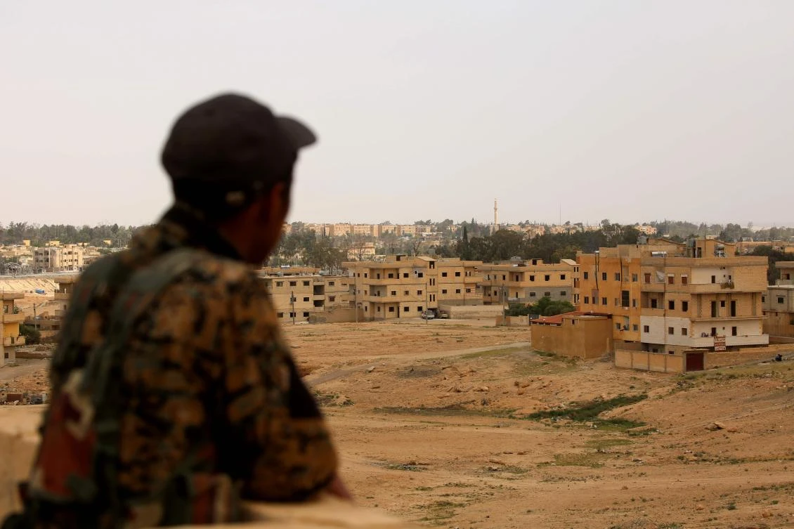 A member of the US-backed Syrian Democratic Forces (SDF), made up of an alliance of Arab and Kurdish fighters, monitors in the town of Tabqa, about 55 kilometres (35 miles) west of Raqa city, on April 30, 2017, as they advance in their battle for the Islamic State group's stronghold. US-backed fighters have captured 80 percent of Syria's Tabqa from the Islamic State group, a monitor said on May 1, a week after they first entered the town. (AFP)