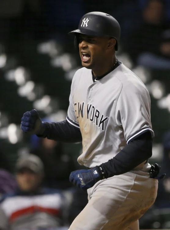 New York Yankees' Aaron Hicks reacts after scoring on a fielder's choice by Chicago Cubs shortstop Addison Russell during the 18th inning of an interleague baseball game Monday in Chicago. (AP)