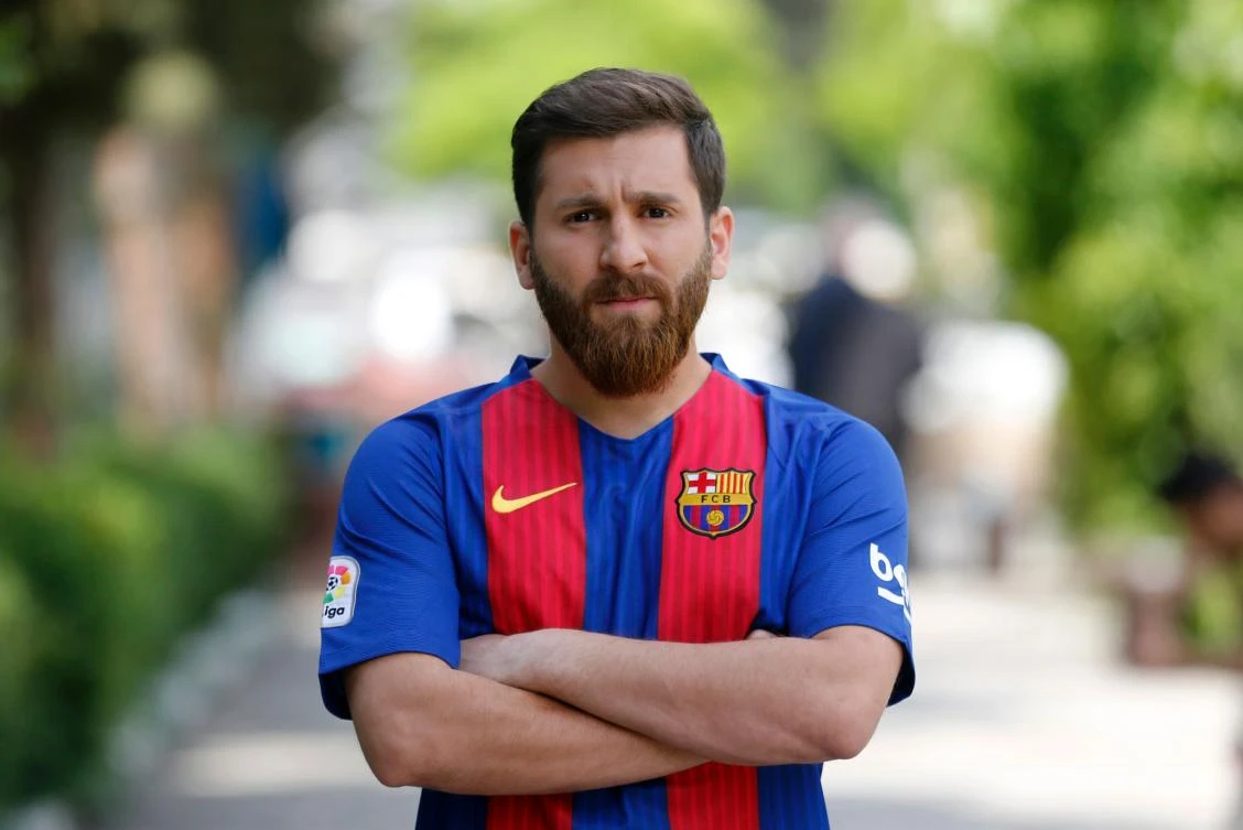 Reza Parastesh, a doppelganger of Barcelona and Argentina’s footballer Lionel Messi, poses for a picture in a street in Tehran on May 8, 2017. (AFP)