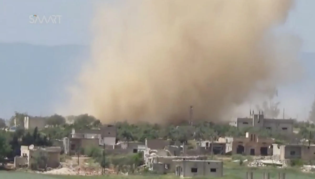 A still image taken from a video posted to a social media website and said to be taken on May 8, 2017, shows smoke rising after what purported to be airstikes hit an area said to be Latamneh, in Hama province, Syria. Syrian government forces and US-backed opposition fighters also clashed on Tuesday in a remote desert area near the borders with Iraq and Jordan, where tensions have been rising. (Social Media Website via Reuters TV)