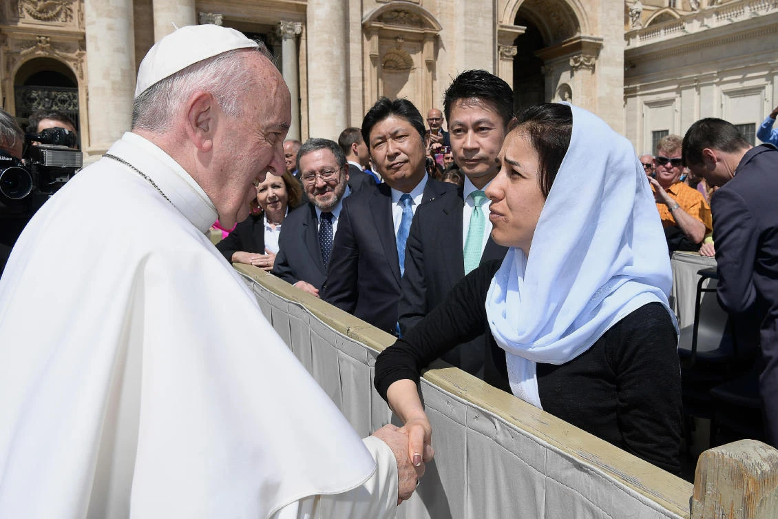 Pope Francis meets Nadia Murad Basee Taha, the Yazidi woman who escaped sexual enslavement by Daesh militants and went on to become advocate for others, during his weekly general audience, at the Vatican on May 3, 2017. (L'Osservatore Romano/Pool Photo via AP)